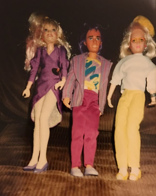 3 dolls from the author's Jem doll collection on her old couch