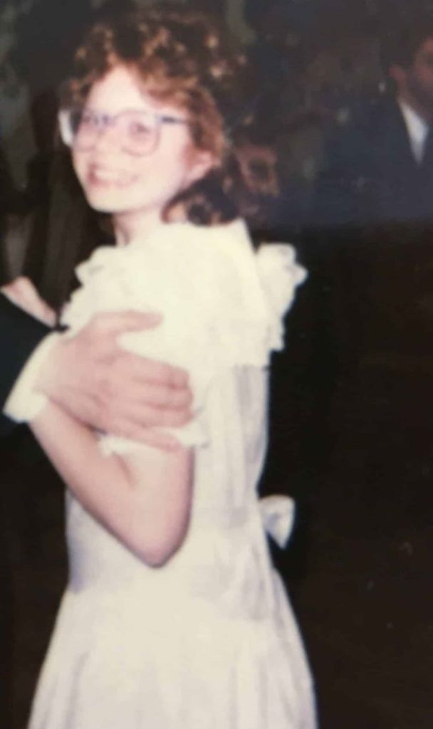 author as a child at a wedding dancing with one of her cousins